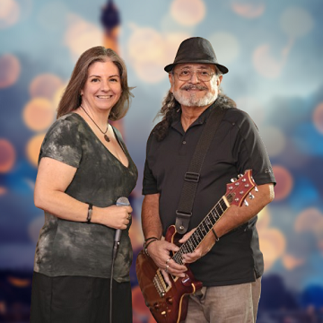 Music Reflections Duo performing live - Robert on guitar and Marla as lead vocalist